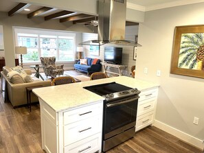 Open kitchen with additional seating at breakfast bar.  