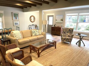 Large comfortable living room with plenty of seating. Original exposed beams.