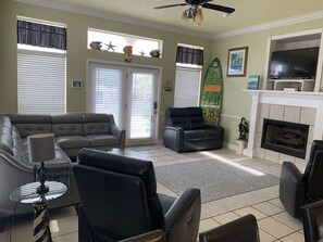Living room has lots of seating & newly added 70 inch TV