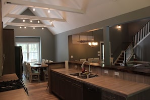 Kitchen is open to dining and living area two sinks