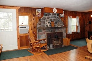 Fieldstone fireplace on upper level