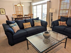Alternate view of the living room with lots of natural light. 