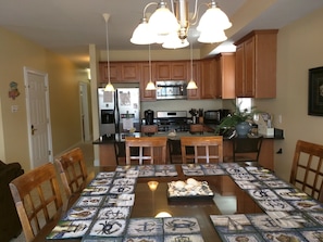 Open kitchen and dining area for socializing while prepping dinner.