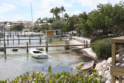 Beautifully remodeled ground level bayfront bridge street property with dock 