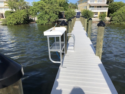 Beautifully remodeled ground level bayfront bridge street property with dock 