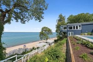 Nest has it's own private stairway to the sandy private association beach