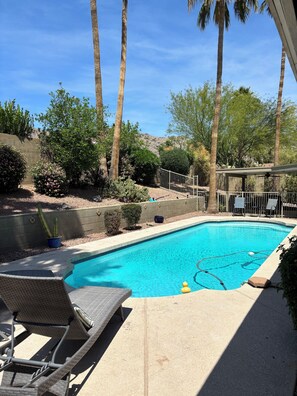 Backyard pool is gated for safety.
