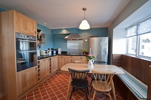 Dining kitchen with excellant range of appliances,table seating 6.