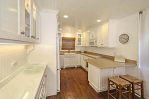 Kitchen Area with Double Farm Sink, and a Fully Stocked Kitchen.