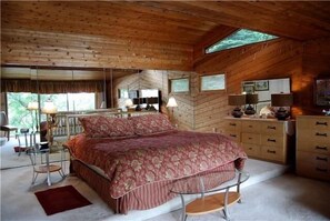 The master bedroom overlooks the  river and is 10 steps from the hot tub!