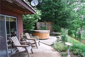 Just steps from the master bedroom, your hot tub overlooks the marsh