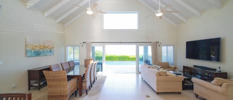 Panoramic pool and Chalk Sound views from living and dining room