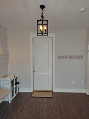 Large entryway and door to 2 car garage.