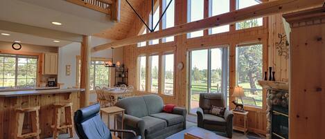 Luxury cabin w/ floor to ceiling windows for un-obstructed golf course views .