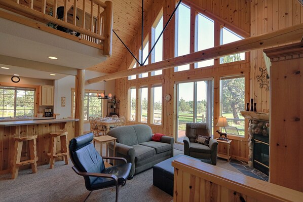 Luxury cabin w/ floor to ceiling windows for un-obstructed golf course views .