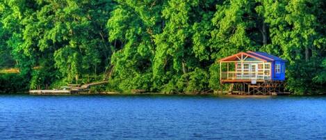 Getaway. This is the boat house and dock below the propety