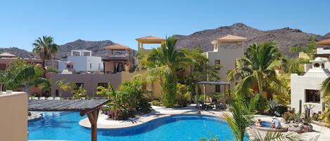 The community pool just outside the door is like an extension of the casa.