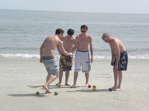 the guys arguing over bucci ball.  Having fun in the sun in front of our unit!