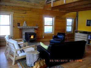  Living room with pellet stove and all brand new furniture.
