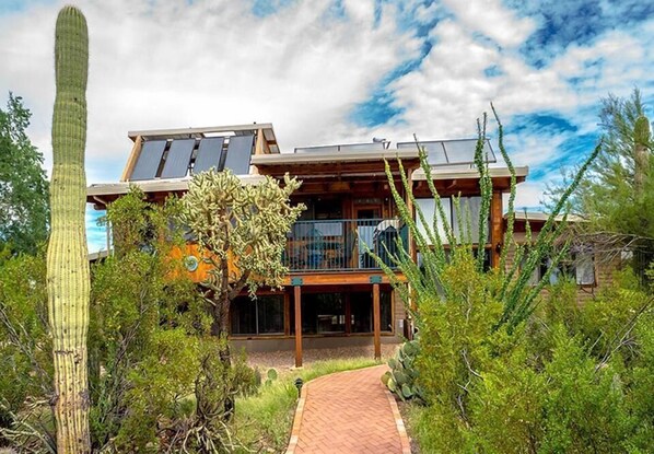 Solar home with elevated deck-view from patio.