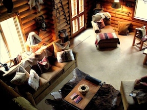 Great room is appointed with western antiques and artifacts.