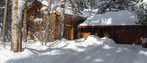 Cabin blanketed in fresh snow.