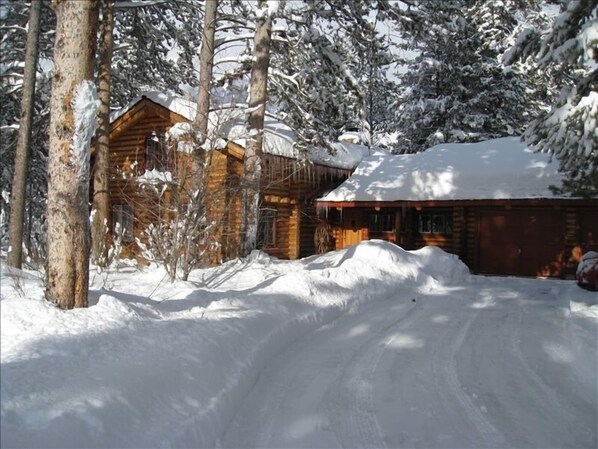 Cabin blanketed in fresh snow.