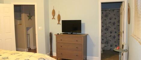 TV and dresser next to the on suite bathroom. (Photo dated-new linen now)