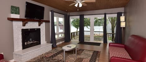 Living Room with 2 sliding glass doors. Private balcony steps away from lake.