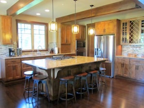 Large kitchen with huge granite island for gathering