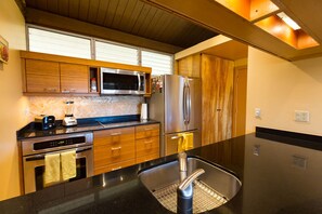 Updated kitchen with stainless appliances.