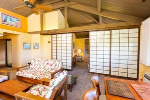 Living area with shoji doors to second bedroom area partially closed.