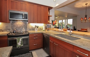 Fully equipped gourmet kitchen with high end appliances.