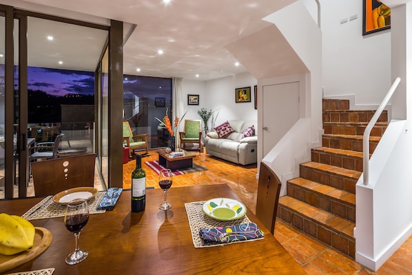 Living room, spiral stairs and dining room