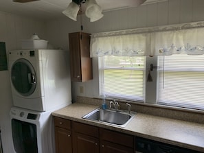 Full kitchen w/ washer & dryer.

