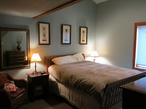 Room with queen sized bed.