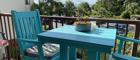 Outdoor pub table with two chairs and two stools