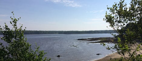 The sand beach, high tide, seen from the trail out to the end of the Point.