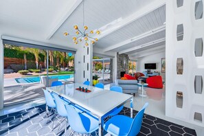 Indoor dining for 8 with views of backyard, pool and mountains