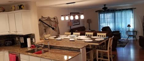 kitchen on second floor looking into living and dining area