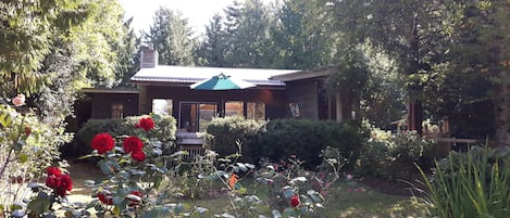 House with front garden. Views from the deck towards Denman and Vancouver Island