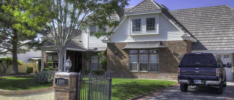 Beautiful Trees and green grass greet you as you park in the gated driveway.