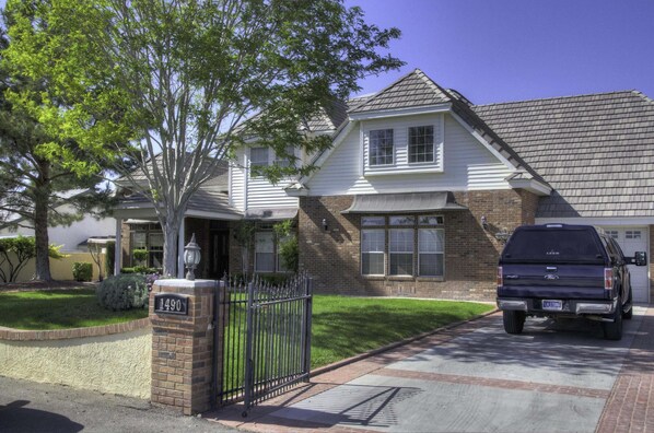 Beautiful Trees and green grass greet you as you park in the gated driveway.