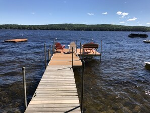 Expansive Dock with Adirondack Chairs, Bench Seat, Swim Ladders and Swim Float