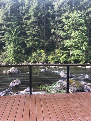Cabled rails allow maximum view of beautiful Snoqualmie river & forested bank.