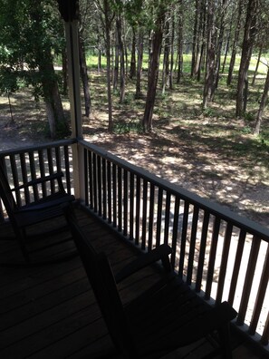 view from porch, with pond just past the near trees