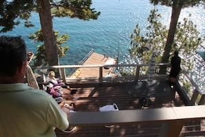 Looking out over the main deck, pier, and Lake Tahoe from the upstairs porch.
