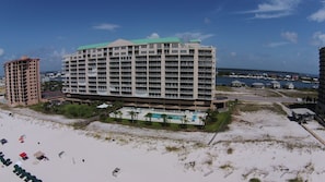 The building is wider than taller. Wide building = Wide beach = lots of room!