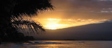 Breathtaking sunrise over Mt. Haleakala and Ma'alaea Bay from our beach