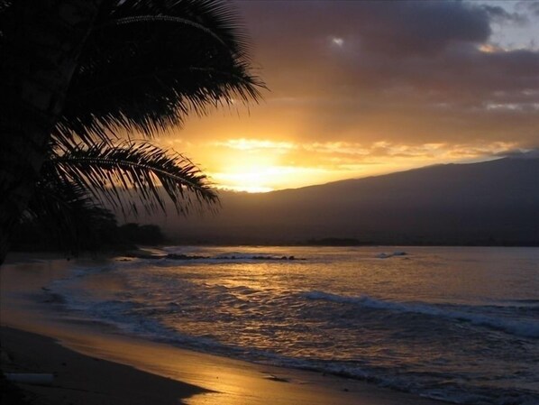 Breathtaking sunrise over Mt. Haleakala and Ma'alaea Bay from our beach